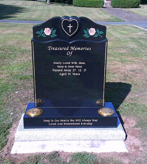 The Dinas memorial headstone with hand painted pink roses