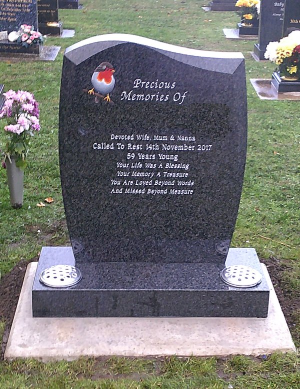 The Avon memorial headstone with a hand painted detailed robin
