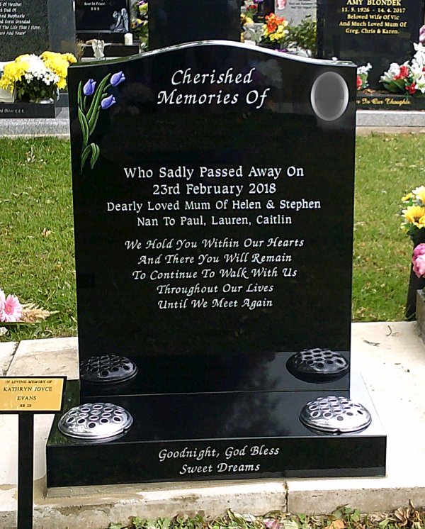 The Saddle memorial headstone with photo plaque and hand painted tulips