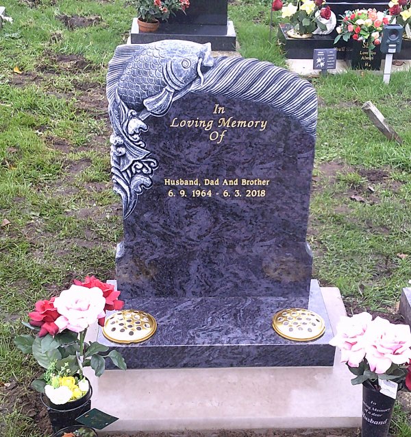 The Ocean memorial headstone with a completely custom fish hand carving