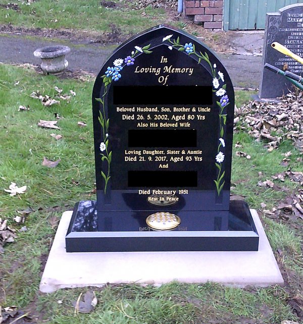The Carlton memorial headstone with hand painted lillies in gothic style
