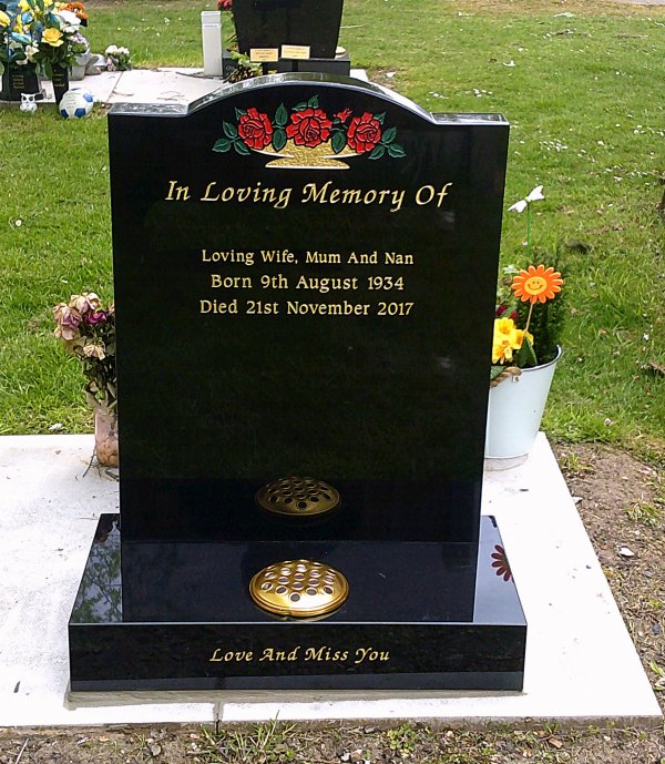 The Hereford memorial headstone with hand painted red roses